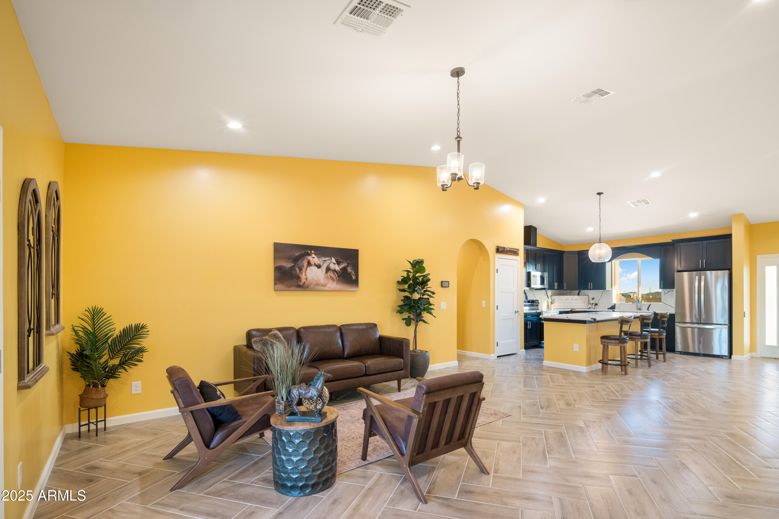 35684 West Chipman Road Tonopah, AZ 85354 - Photo 9 of 39 a open kitchen with a table and chairs