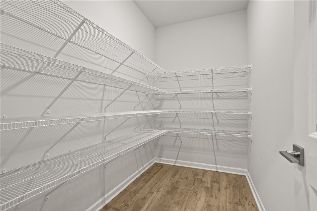 631 Sweetspire Trail, Unit 148 Seneca, SC 29678 - Photo 9 of 36 Ample wire shelving units maximize storage capacity within this organized pantry.