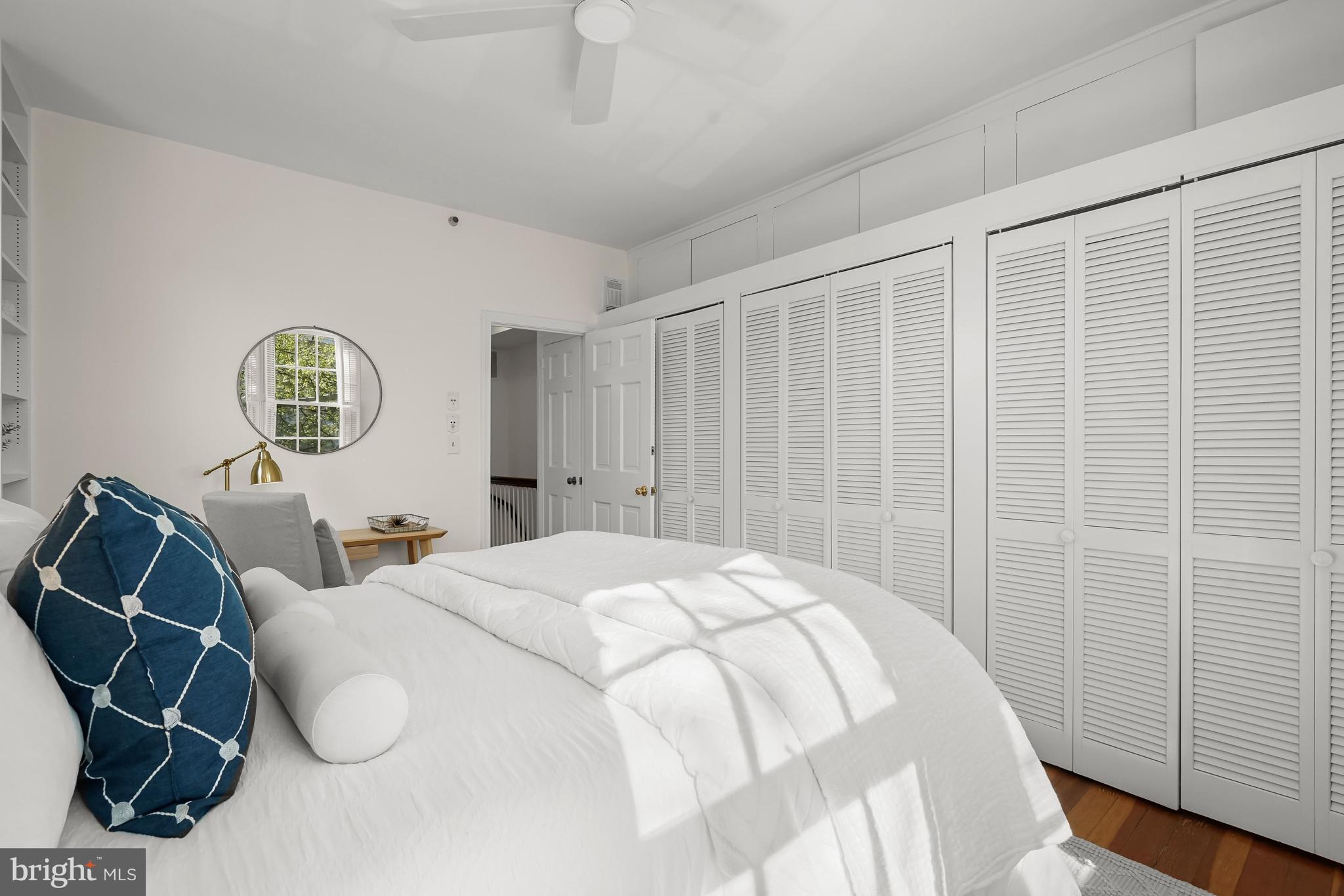 1654 34th Street Northwest Washington, DC 20007 - Photo 13 of 18 Primary bedroom with wall of closets