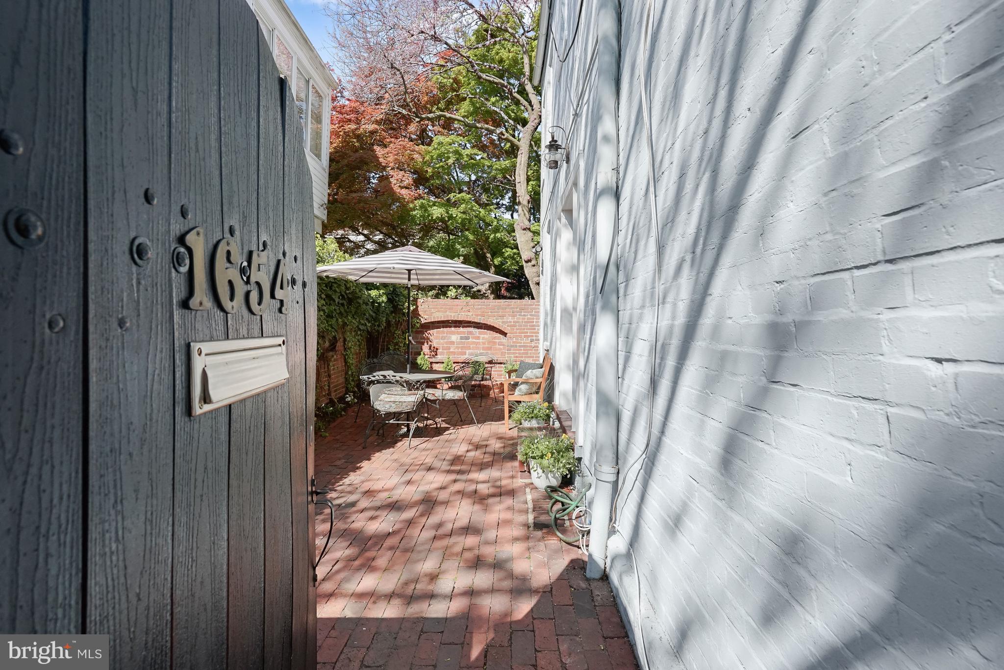 1654 34th Street Northwest Washington, DC 20007 - Photo 2 of 18 Enter the garden gate into secret walled garden