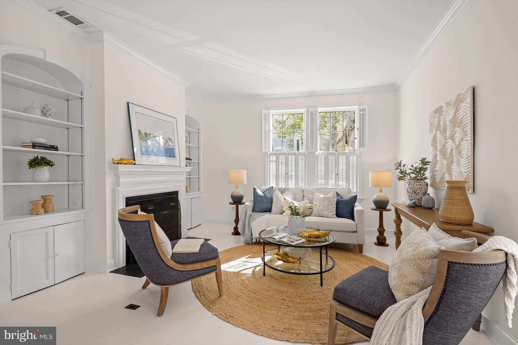 1654 34th Street Northwest Washington, DC 20007 - Photo 6 of 18 Living room with fireplace and arched built-ins