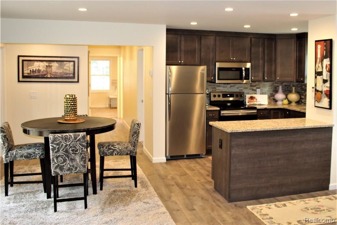 8869 Inkster Road Livonia, MI 48150 - Photo 3 of 17 Custom Kitchen with Granite and Glass Backsplash