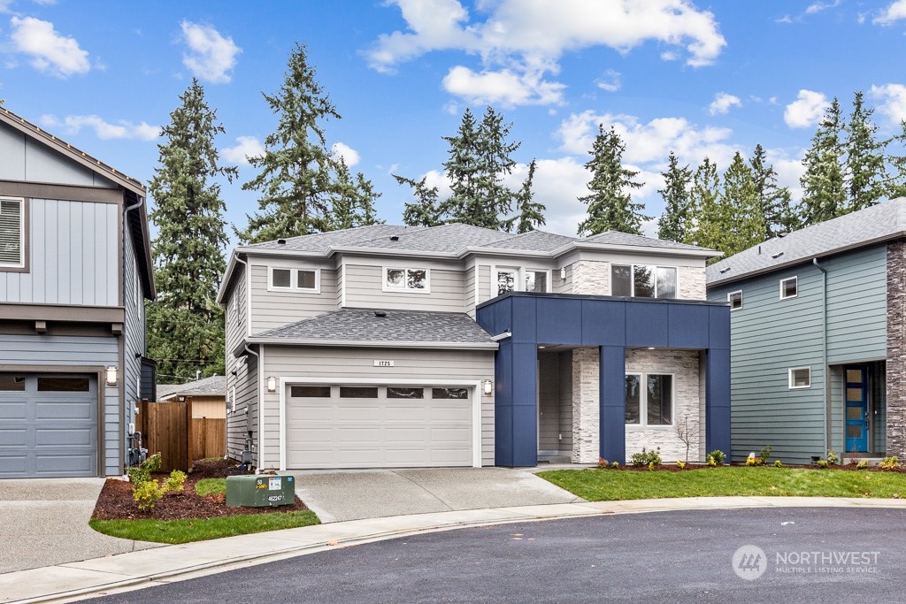 2106 228th Place Southwest, Unit EP 43 Bothell, WA 98021 - Photo 1 of 24 a front view of a house with yard