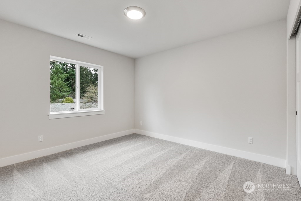 2106 228th Place Southwest, Unit EP 43 Bothell, WA 98021 - Photo 19 of 24 an empty room with a window