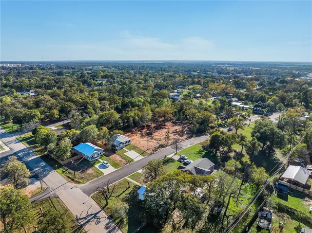 an aerial view of a city with lots of residential buildings