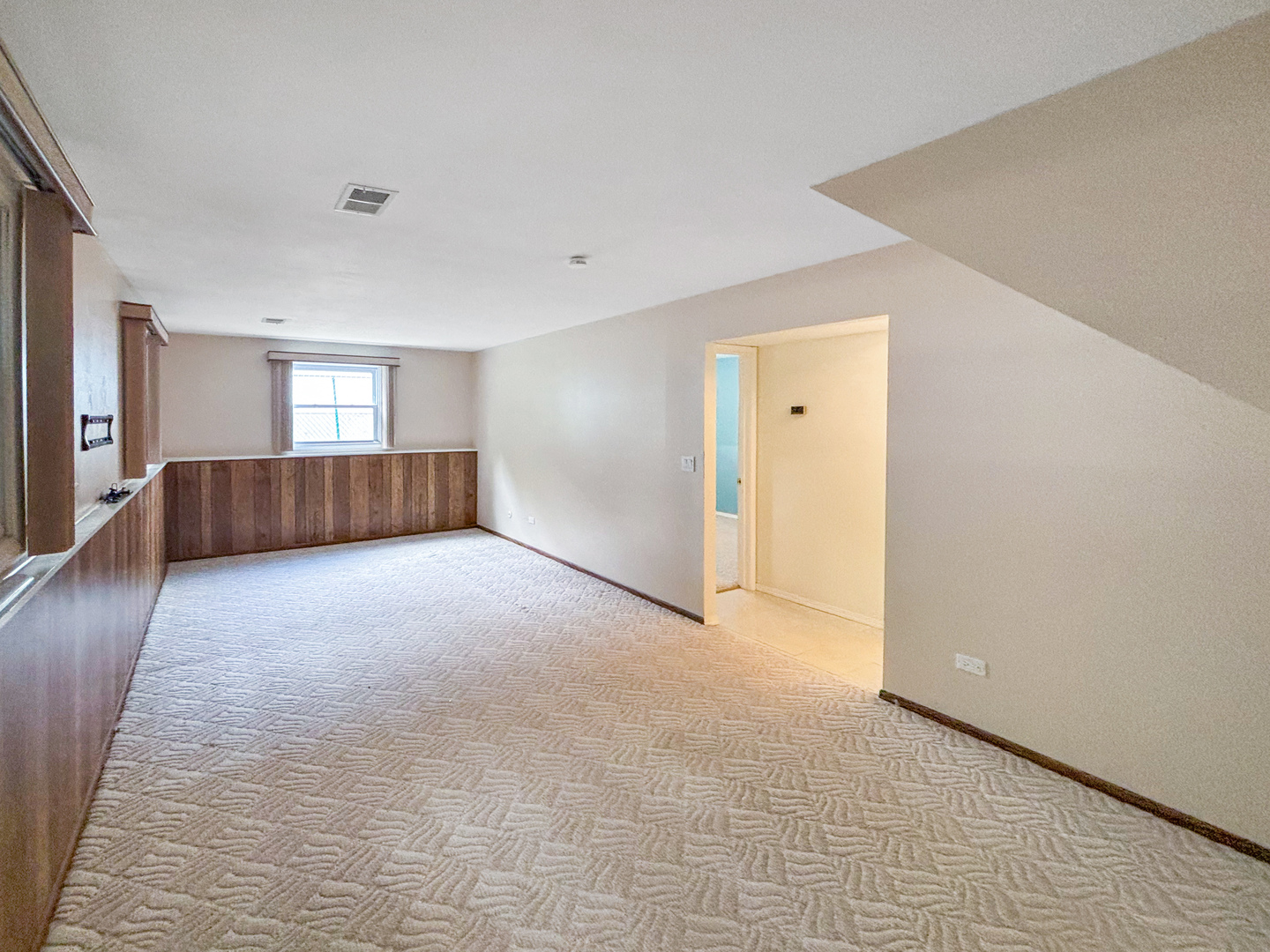 1008 18th Street Zion, IL 60099 - Photo 14 of 19 a view of empty room with wooden floor