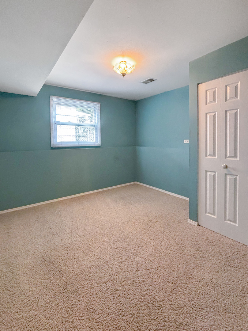 1008 18th Street Zion, IL 60099 - Photo 15 of 19 an empty room with a window