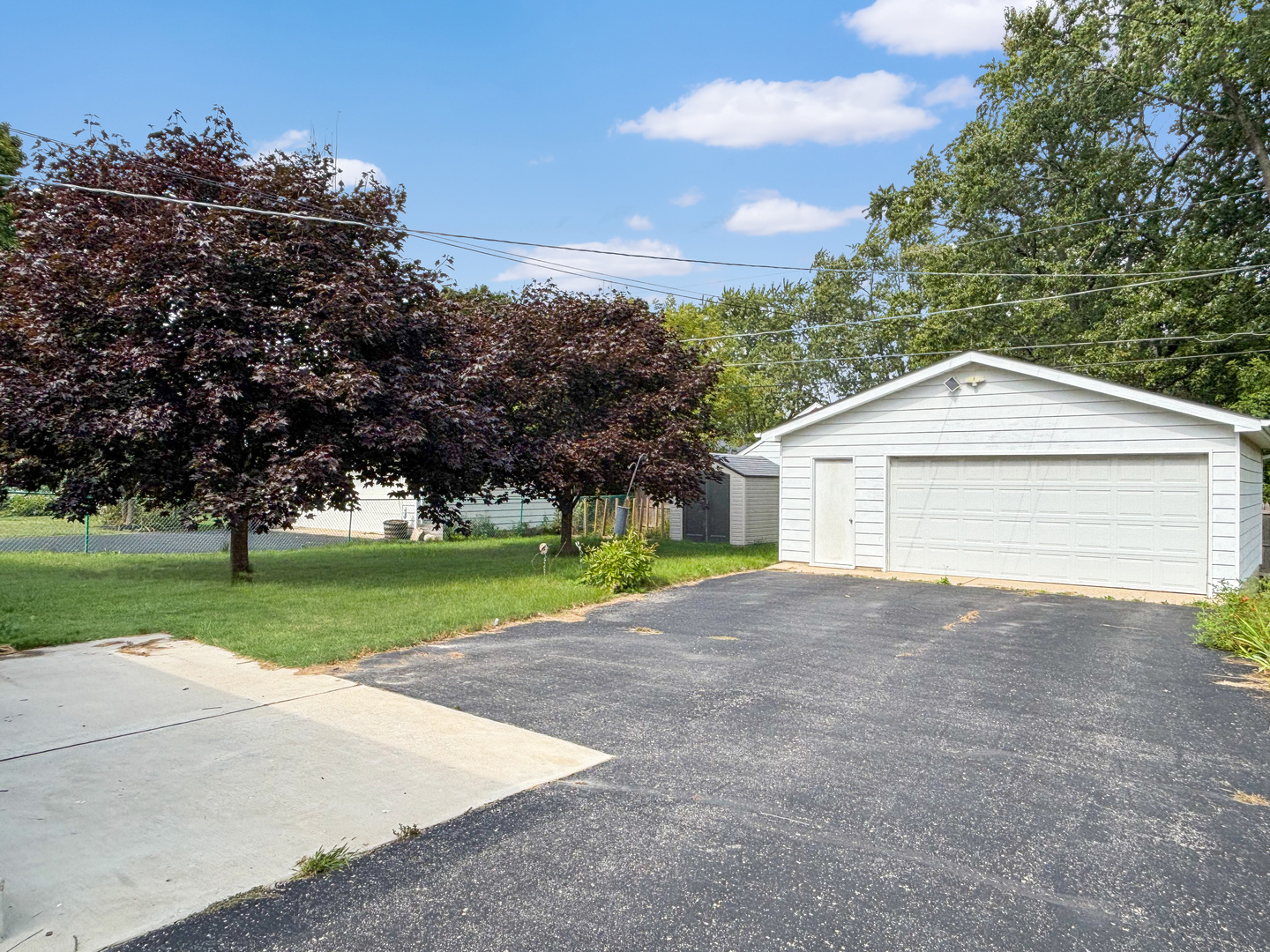 1008 18th Street Zion, IL 60099 - Photo 18 of 19 a front view of house with yard and trees