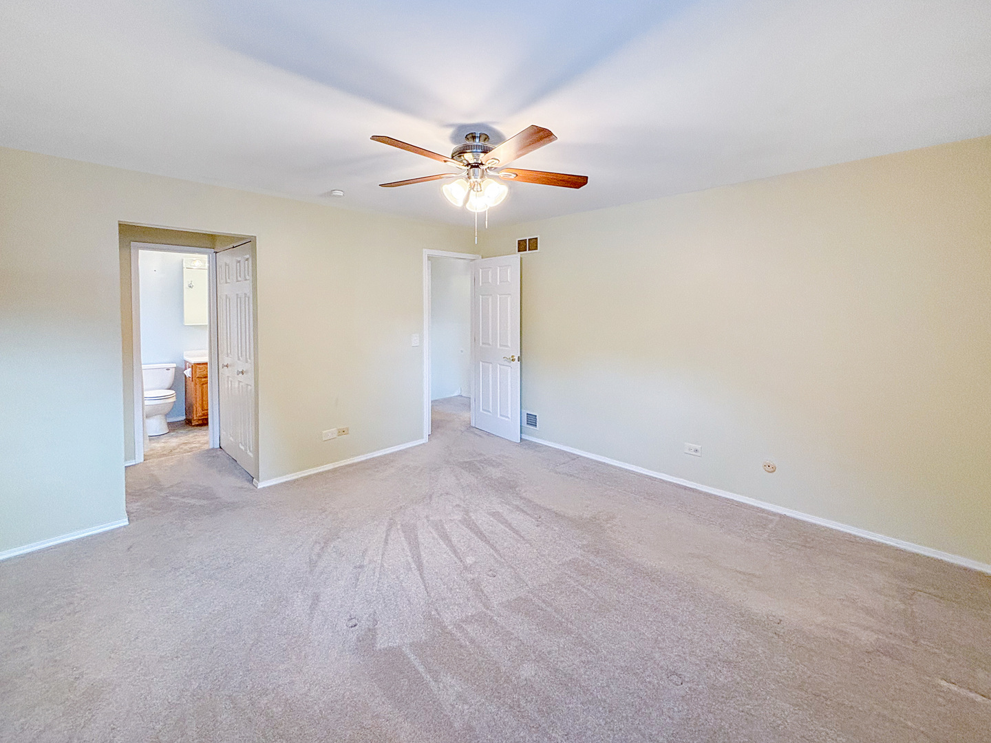1008 18th Street Zion, IL 60099 - Photo 8 of 19 a view of an empty room and a ceiling fan