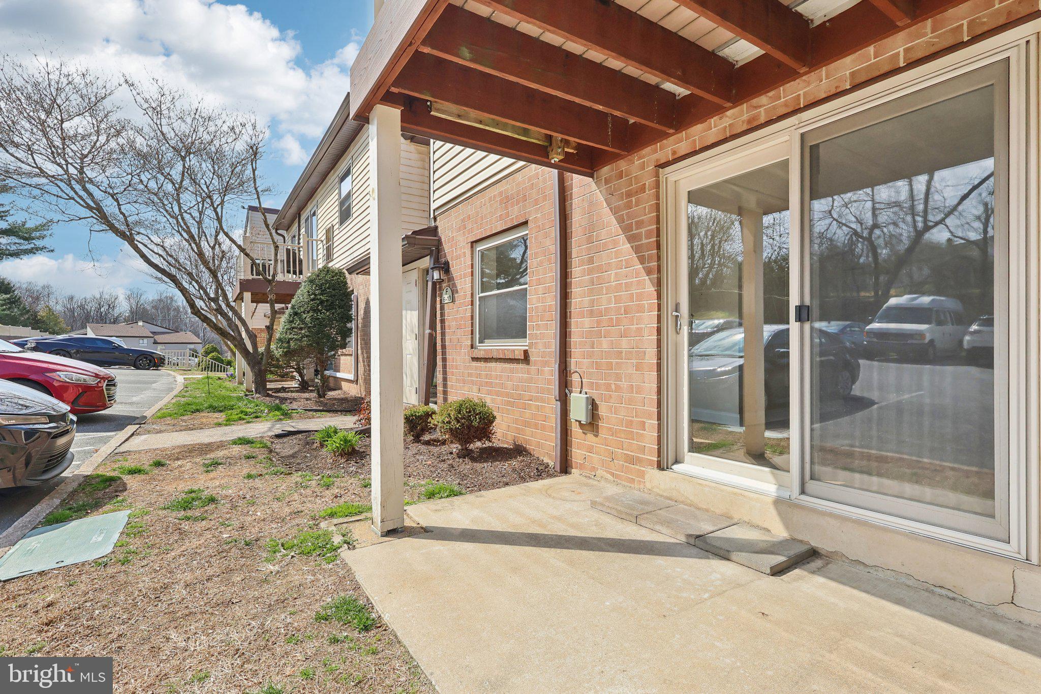 280 Bridgewater Road, Unit F8 Brookhaven, PA 19015 - Photo 16 of 16 Sunny patio with sliding glass door