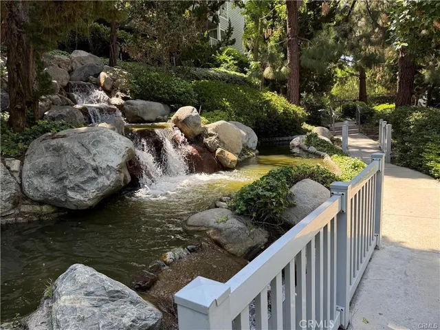 a view of a lake with couches and trees