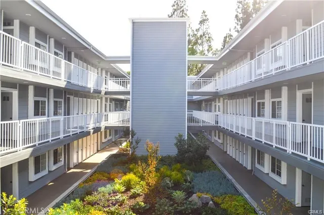 a view of a brick building with a yard