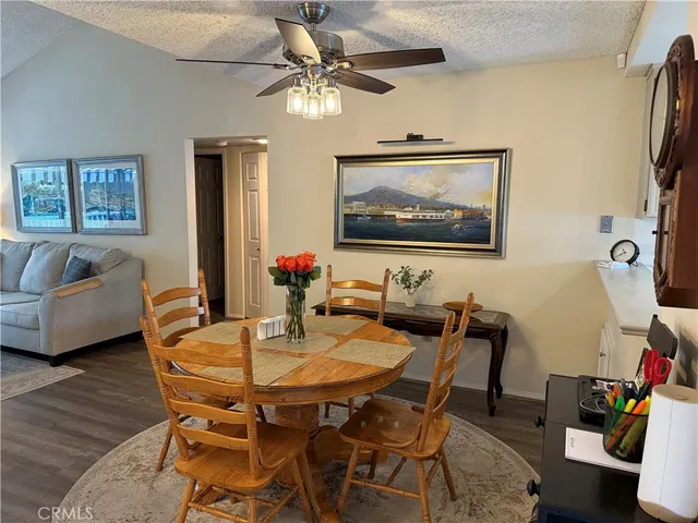 a dining room with furniture and window