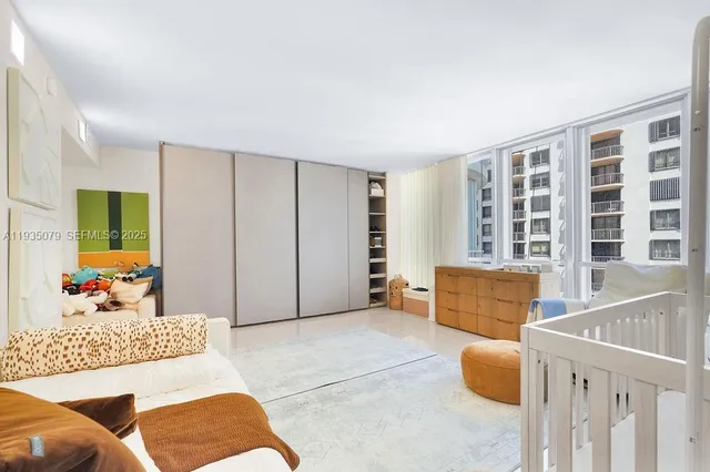 a bedroom with furniture and windows