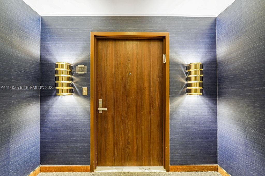 10155 Collins Avenue, Unit 1106 Bal Harbour, FL 33154 - Photo 25 of 29 a view of empty room with wooden floor