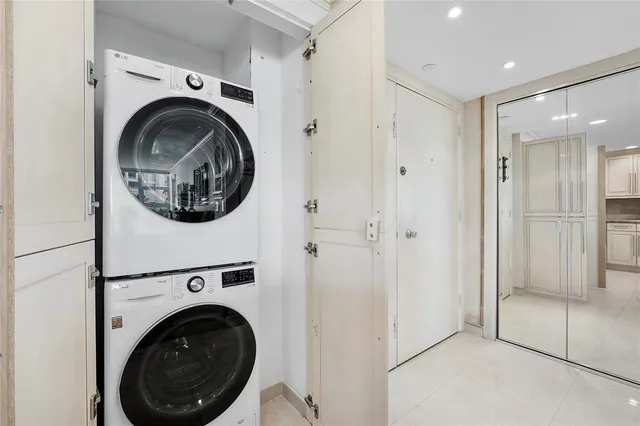 a view of a hallway with washer and dryer