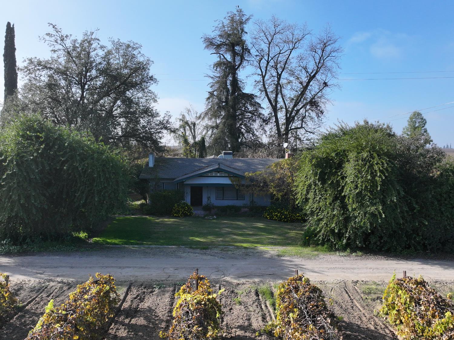 4801 East Parlier Avenue Fowler, CA 93625 - Photo 39 of 52 front view of a house with a yard