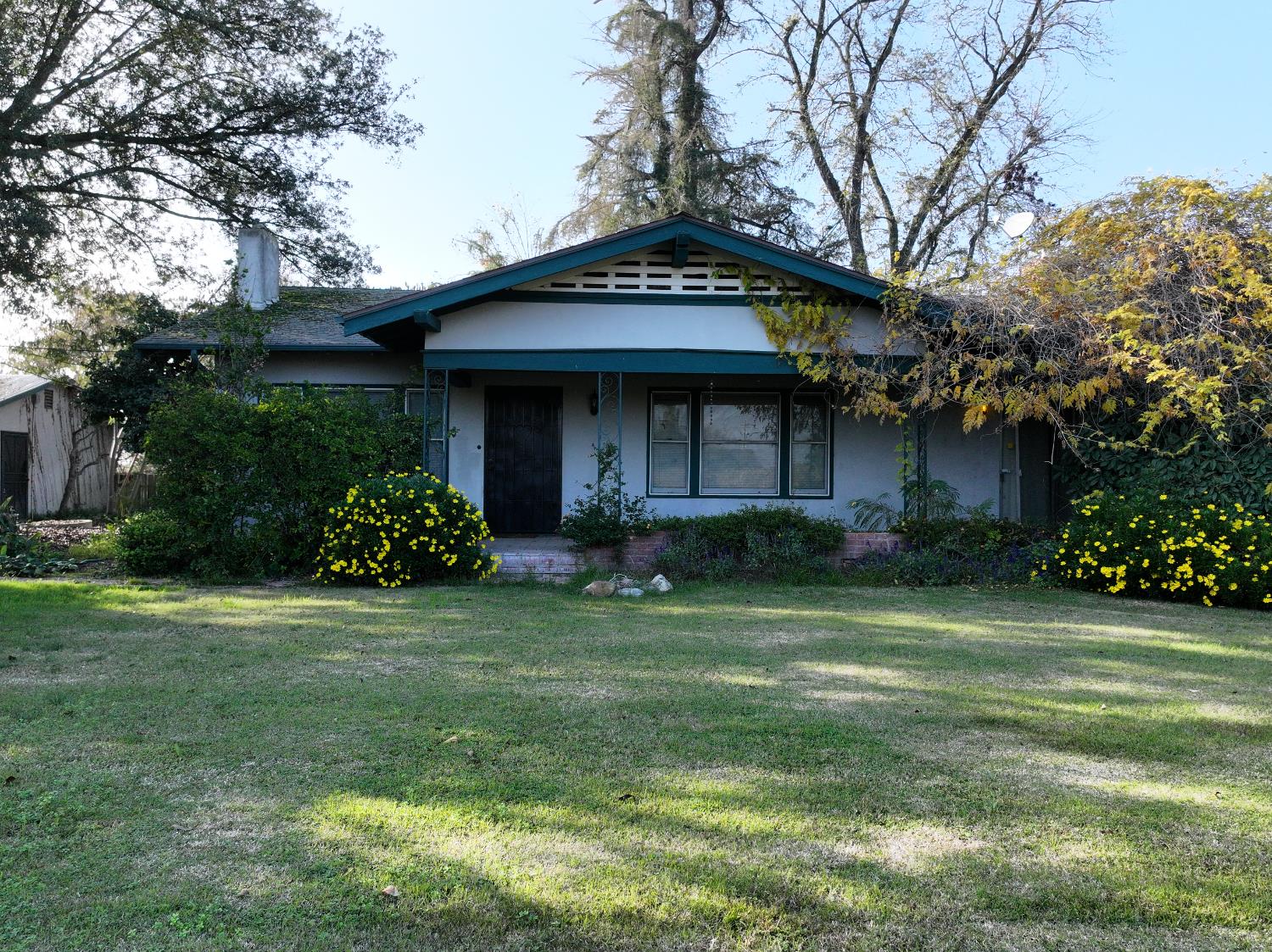 4801 East Parlier Avenue Fowler, CA 93625 - Photo 42 of 52 a front view of a house with a garden