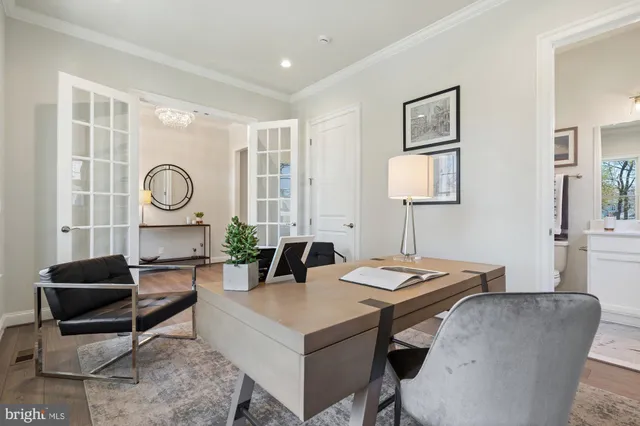 a living room with fireplace furniture and a wooden floor