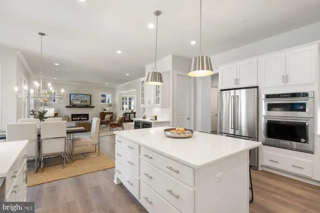 a white bath tub sitting in a bathroom next to a window