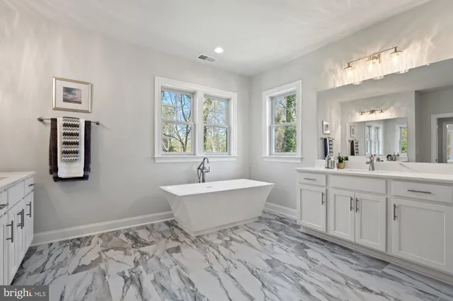 a view of an empty room with a fireplace