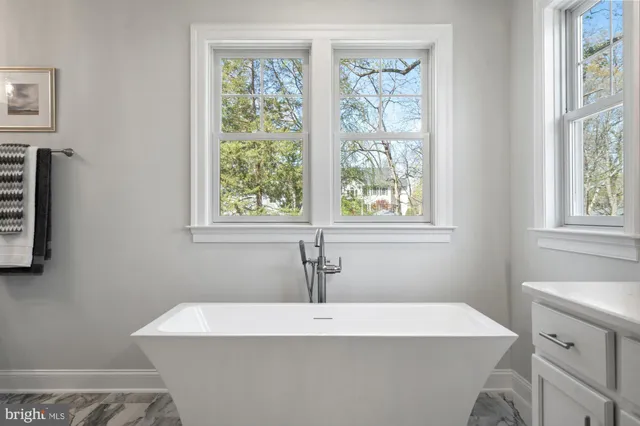 a bathroom with a sink a vanity and a mirror