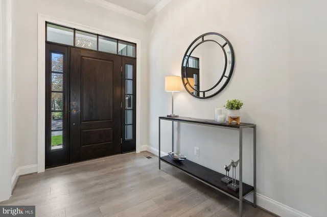 a living room with furniture a rug and a window