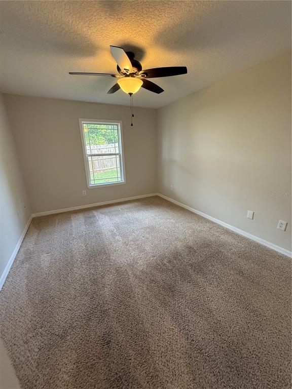 237 Northeast Gum Swamp Road Lake City, FL 32055 - Photo 20 of 34 a view of an empty room with a window