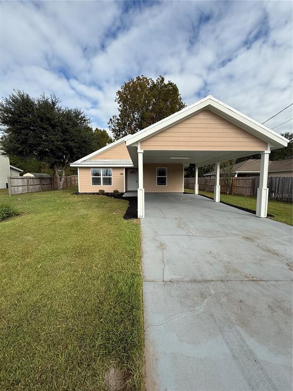 237 Northeast Gum Swamp Road Lake City, FL 32055 - Photo 2 of 34 a view of a house with garden