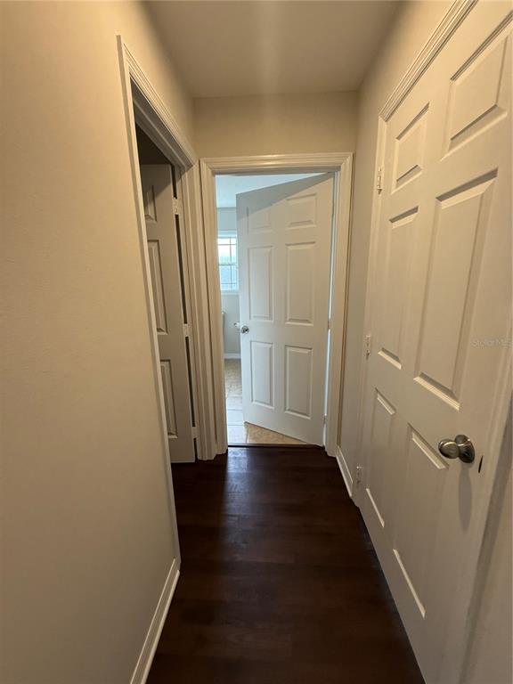 237 Northeast Gum Swamp Road Lake City, FL 32055 - Photo 21 of 34 an empty room with wooden floor and a shower