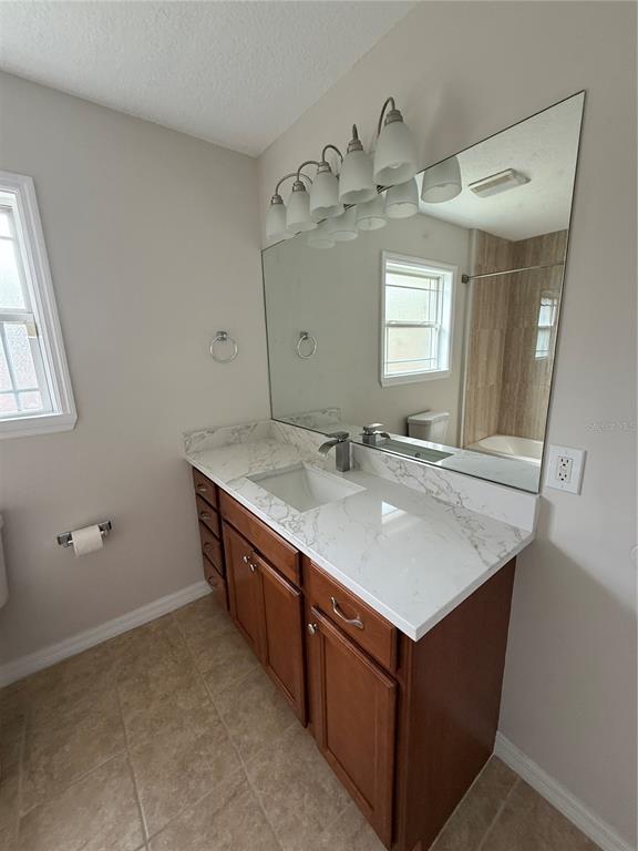237 Northeast Gum Swamp Road Lake City, FL 32055 - Photo 24 of 34 a bathroom with a sink vanity and mirror