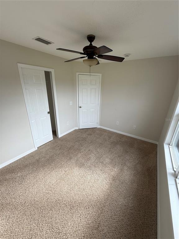 237 Northeast Gum Swamp Road Lake City, FL 32055 - Photo 27 of 34 an empty room with a window