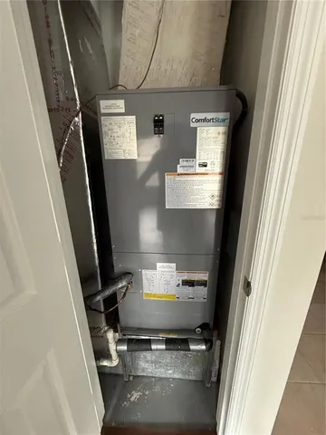 a view of a field with trees in the background