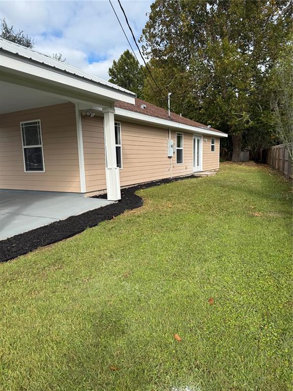 237 Northeast Gum Swamp Road Lake City, FL 32055 - Photo 6 of 34 a front view of house with yard and trees
