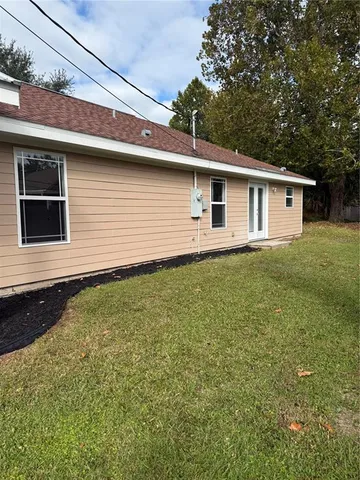 a backyard of a house with lots of green space