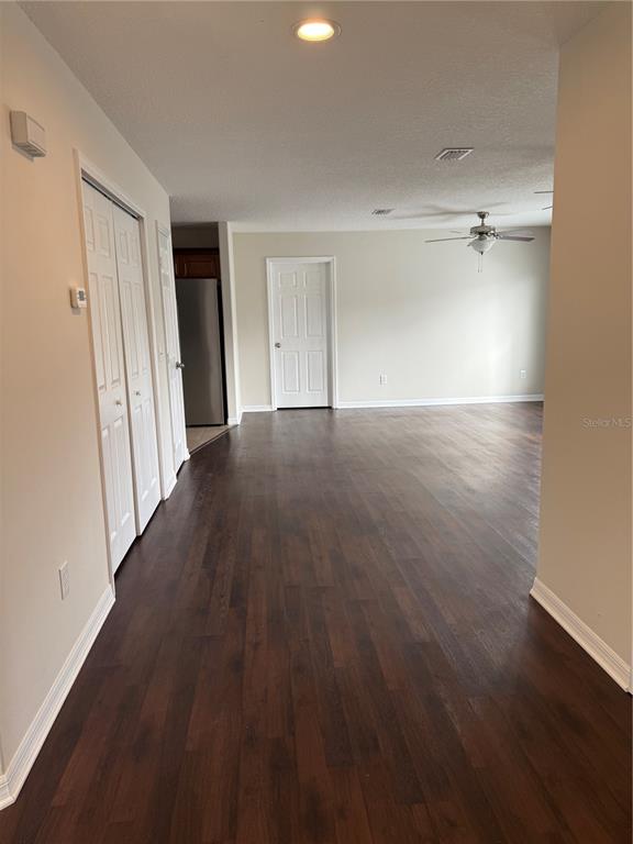 237 Northeast Gum Swamp Road Lake City, FL 32055 - Photo 9 of 34 a view of an empty room with wooden floor and a window