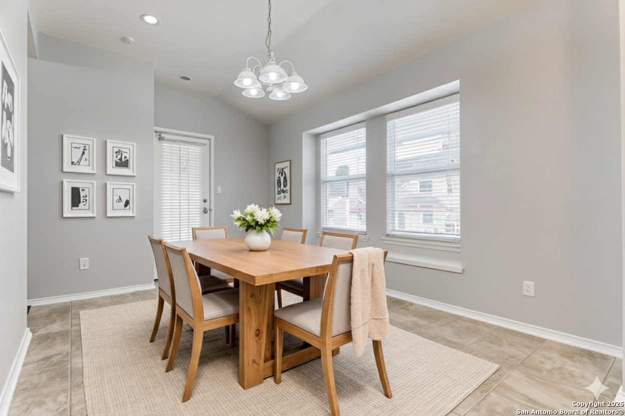 3603 Aranda Fields Converse, TX 78109 - Photo 4 of 13 a view of a dining room with furniture and chandelier