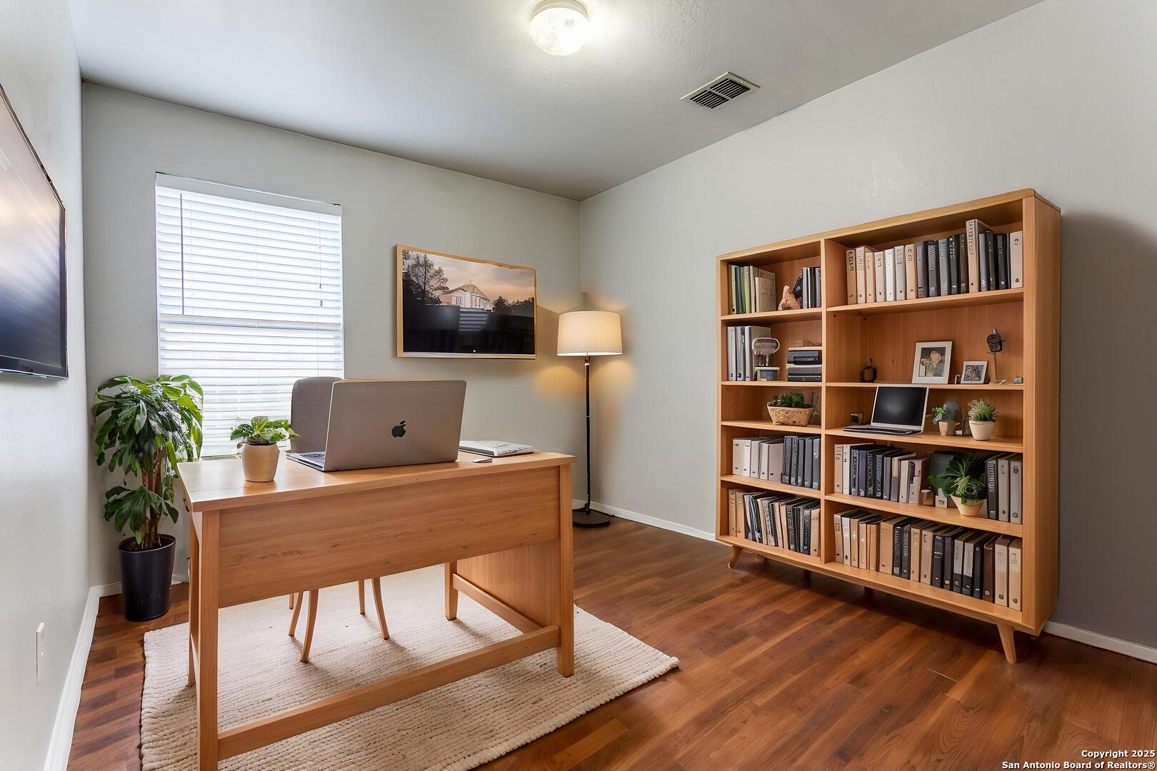 3603 Aranda Fields Converse, TX 78109 - Photo 7 of 13 a workspace with furniture window and wooden floor