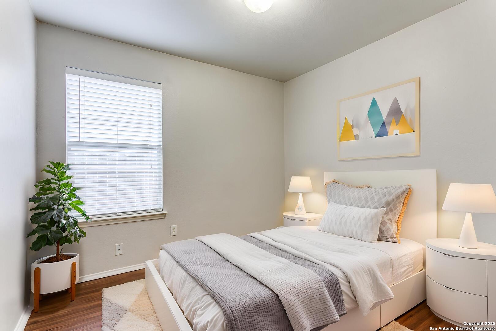 3603 Aranda Fields Converse, TX 78109 - Photo 8 of 13 a bedroom with a bed and a painting on the wall