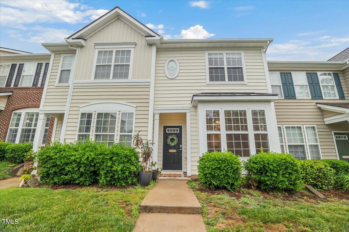 4508 Sugarbend Way Raleigh, NC 27606 - Photo 1 of 39 a front view of a house with garden