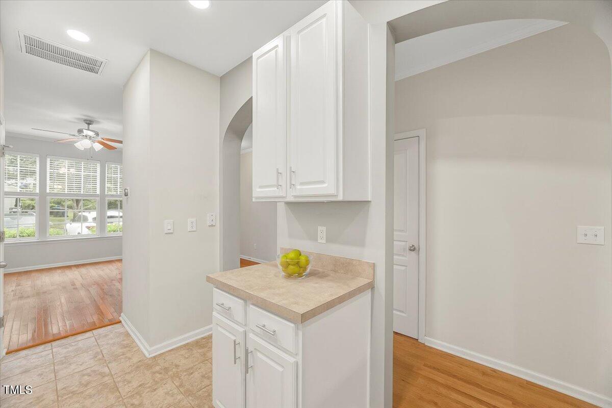 4508 Sugarbend Way Raleigh, NC 27606 - Photo 12 of 39 a view of hallway with wooden floor and cabinet