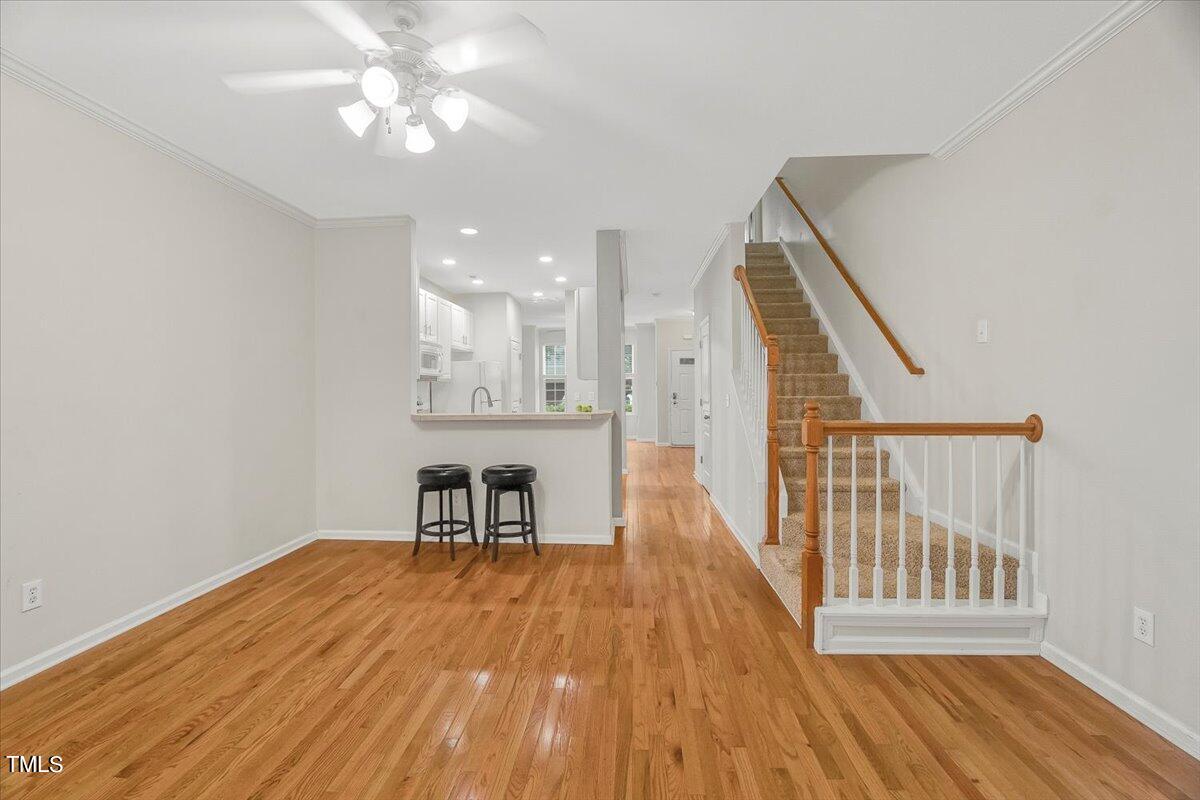4508 Sugarbend Way Raleigh, NC 27606 - Photo 17 of 39 wooden floor in an empty room with a window