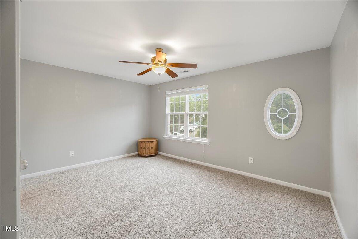 4508 Sugarbend Way Raleigh, NC 27606 - Photo 19 of 39 an empty room with a window