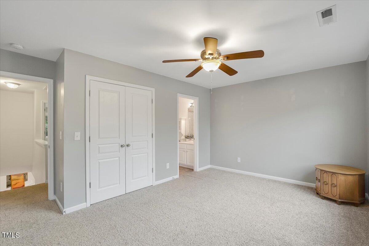 4508 Sugarbend Way Raleigh, NC 27606 - Photo 20 of 39 a view of an empty room and chandelier fan