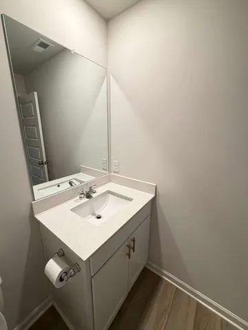 a bathroom with a sink and mirror