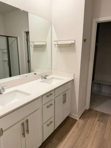 a bathroom with a glass shower door
