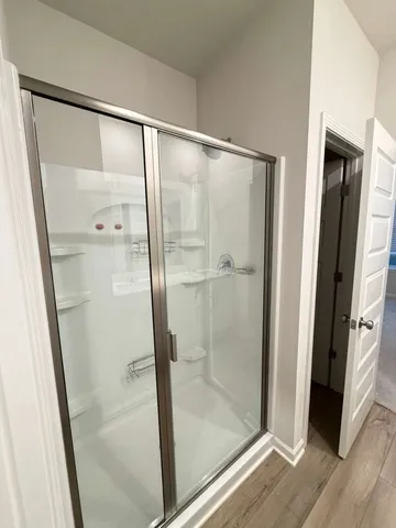 a bathroom with a double vanity sink and mirror