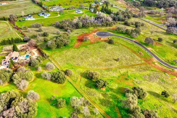 a view of a lake with a yard