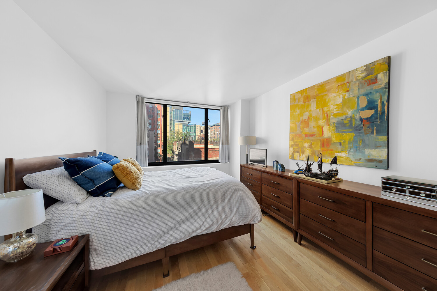 1438 3rd Avenue, Unit 7A Manhattan, NY 10028 - Photo 4 of 12 a bedroom with a bed and a window