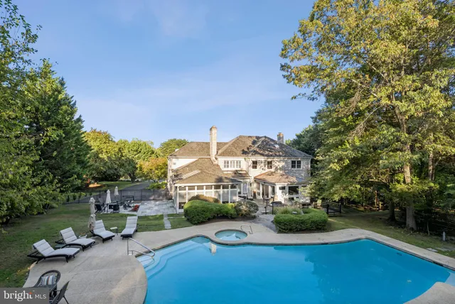 a front view of a house with garden and street view